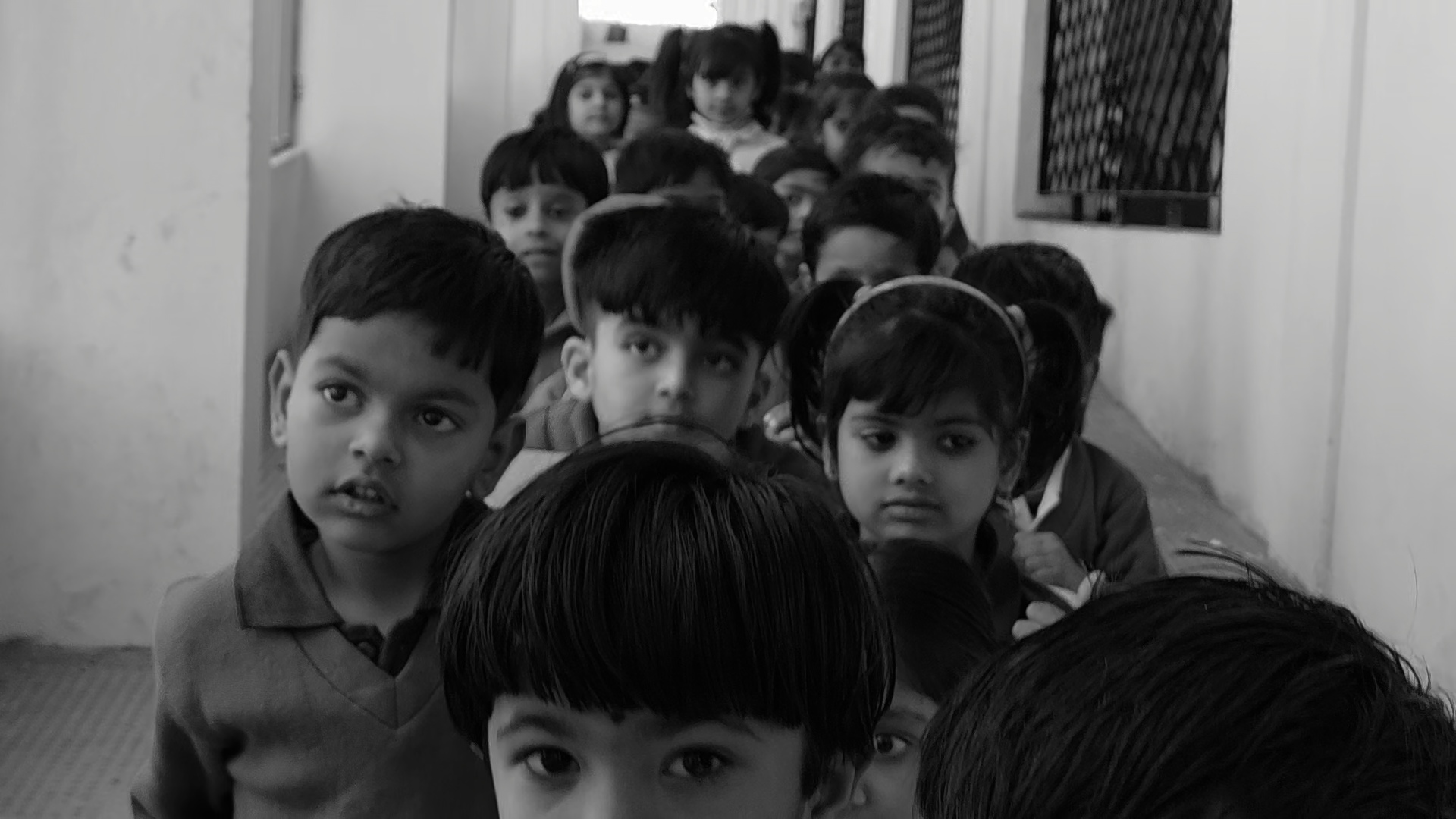 Students lined up in a school corridor